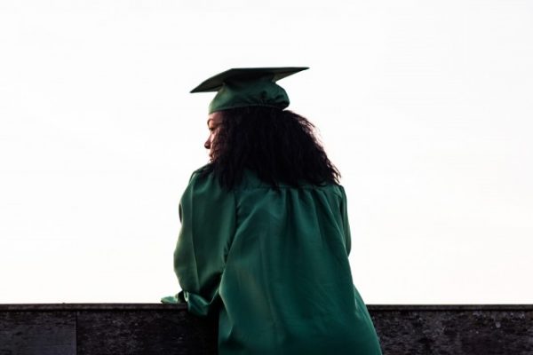 black graduate in green gown