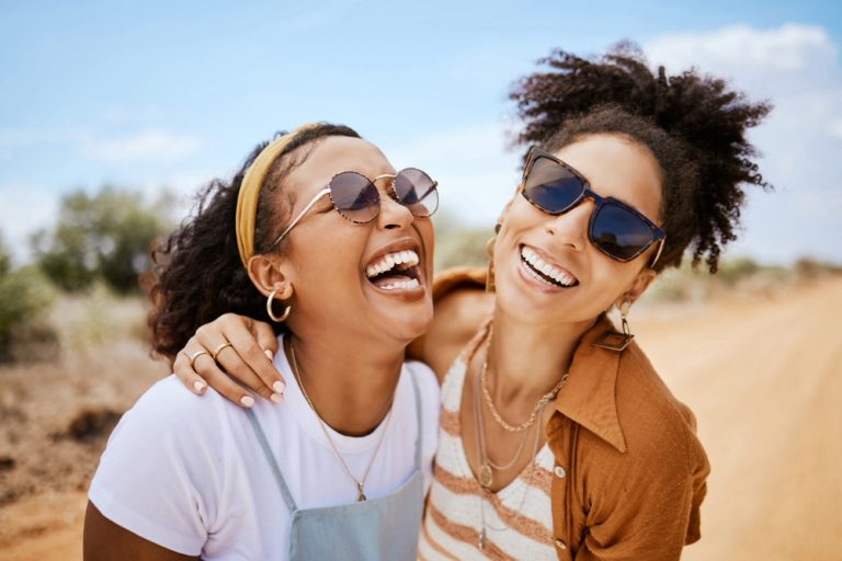 two clothed black women on National No Bra Day