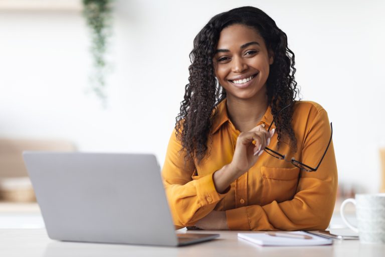 Black woman pleased after following up on job interview.