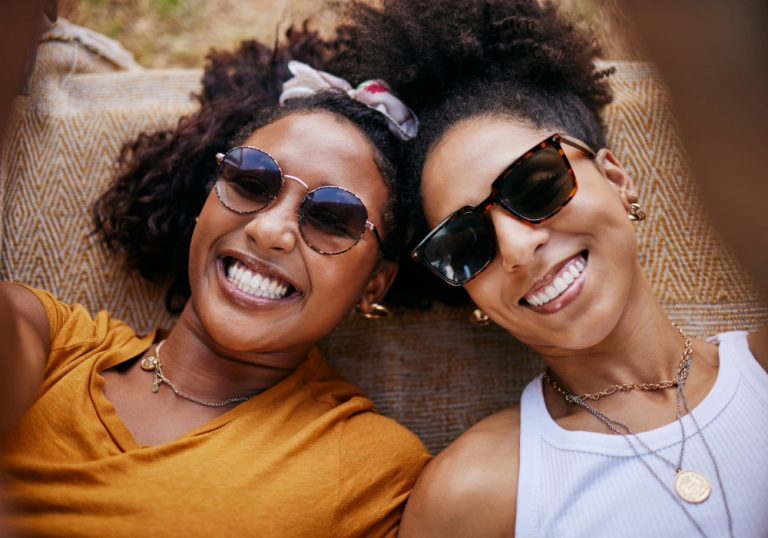 sisterhood displayed by two black women taking a selfie