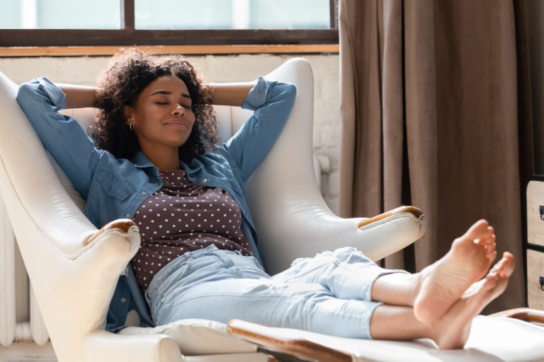 Black woman relaxing and enjoying singlehood.