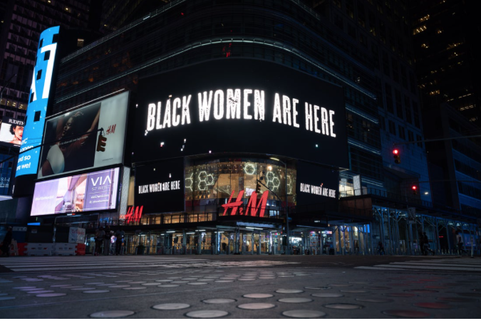 Buy From a Black Woman Banner on building