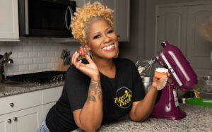 Latrice Pace holding strawberry. 