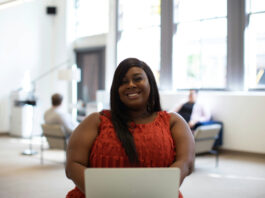 Black woman at computer leveling up