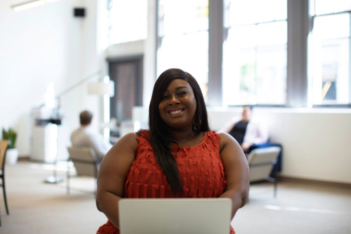 Black woman at computer leveling up