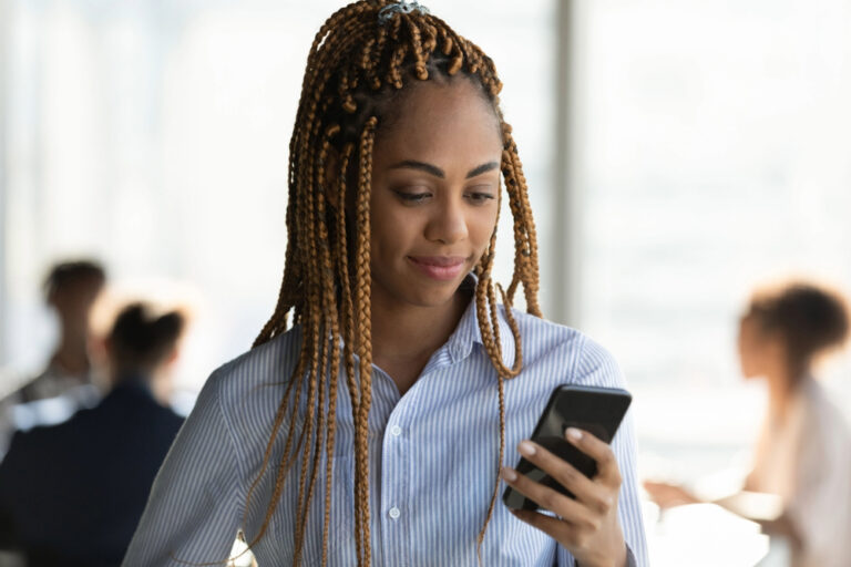 Young Black woman using social media to job search.