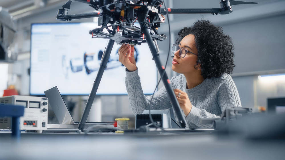 Black woman working in STEM and thinking of climbing the career ladder.