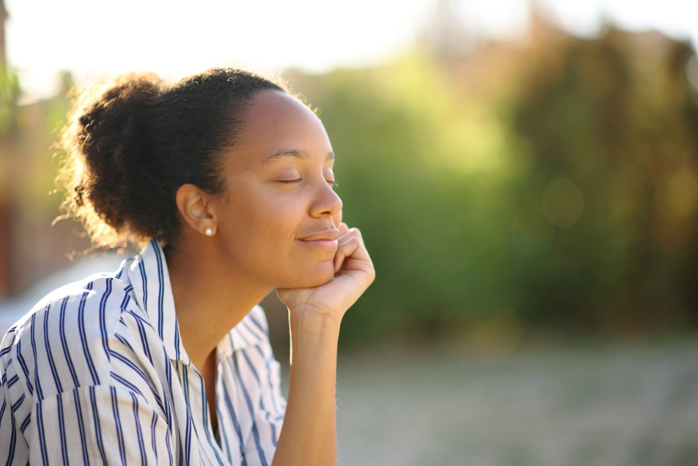 Black woman practicing mindfulness for mental health