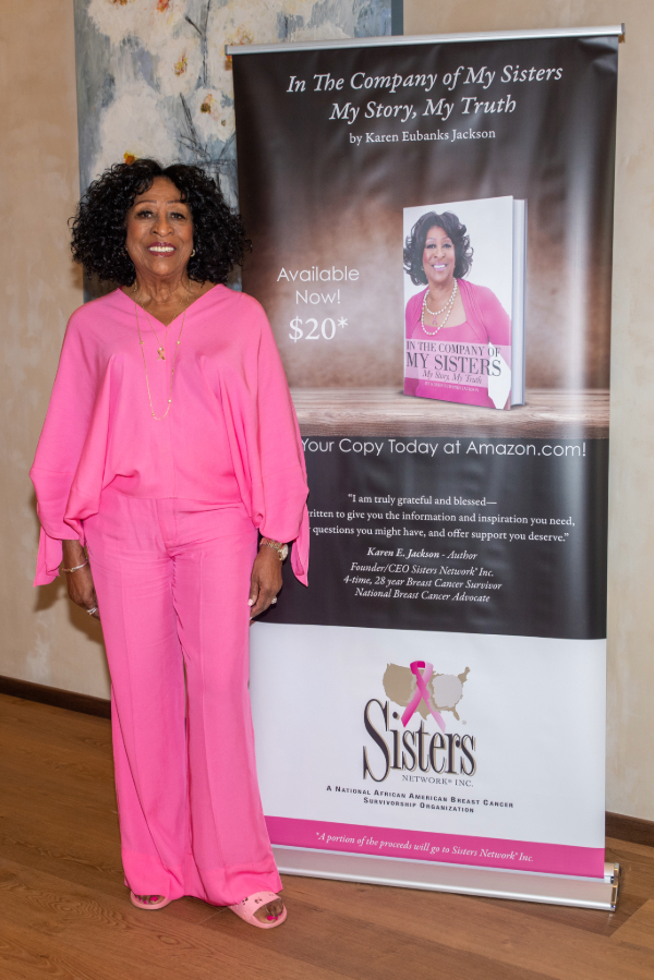 Karen Eubanks Jackson of Sisters Network Inc. in front of In the Company of My Sisters Backdrop