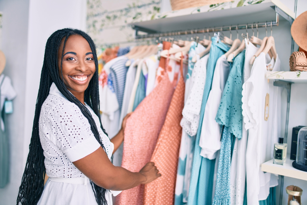 Black woman in thrift store living thrifty.