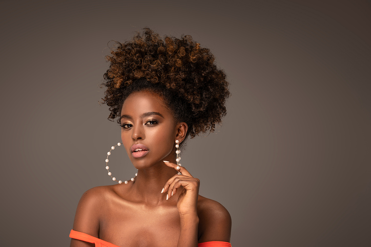 Black woman looking confident after delivering a clapback.