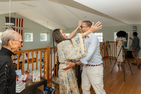 Sunny Hostin and Don Lemon hug at Black Authors Festival