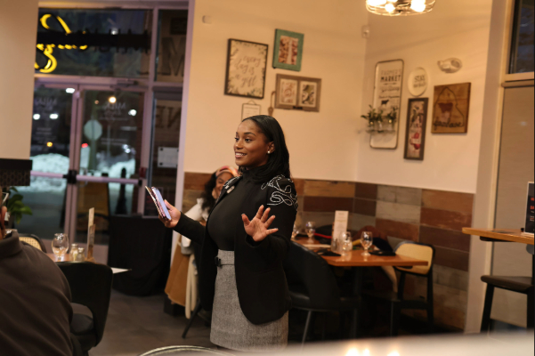 Krystal Carter introducing Nicole at the Barter Black ® App Launch event in Bowie.