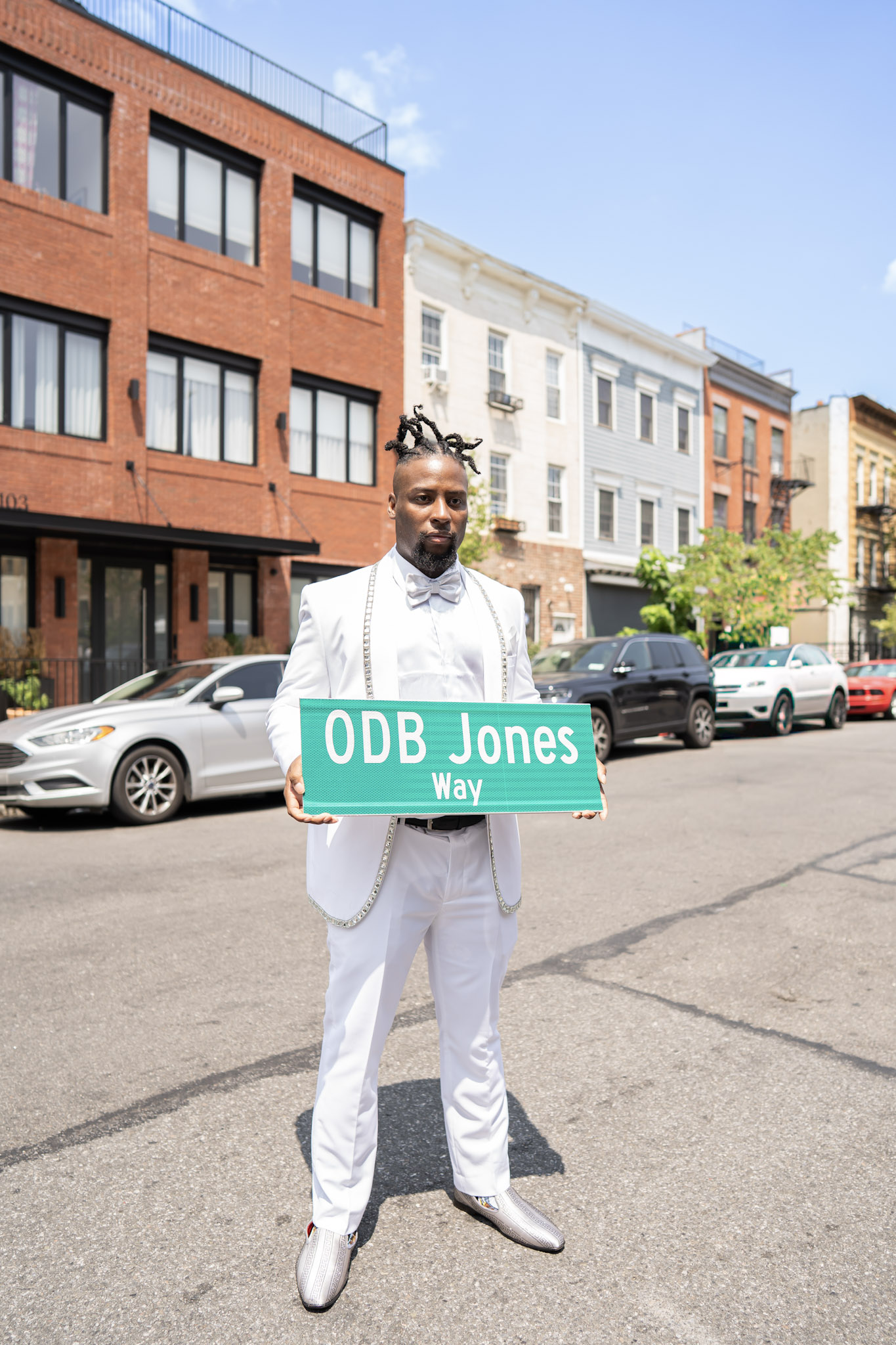 Young Dirty Bastard hold the ODB Jones Way sign at the street naming ceremony in Brooklyn.