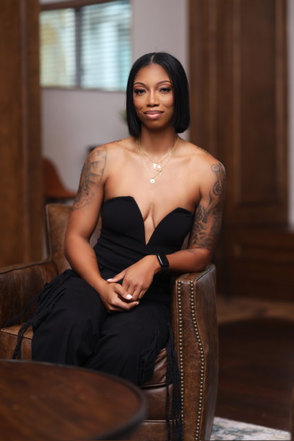 Aiesha Collins on Building Aligned Strength From the Inside Out Aisha in chair