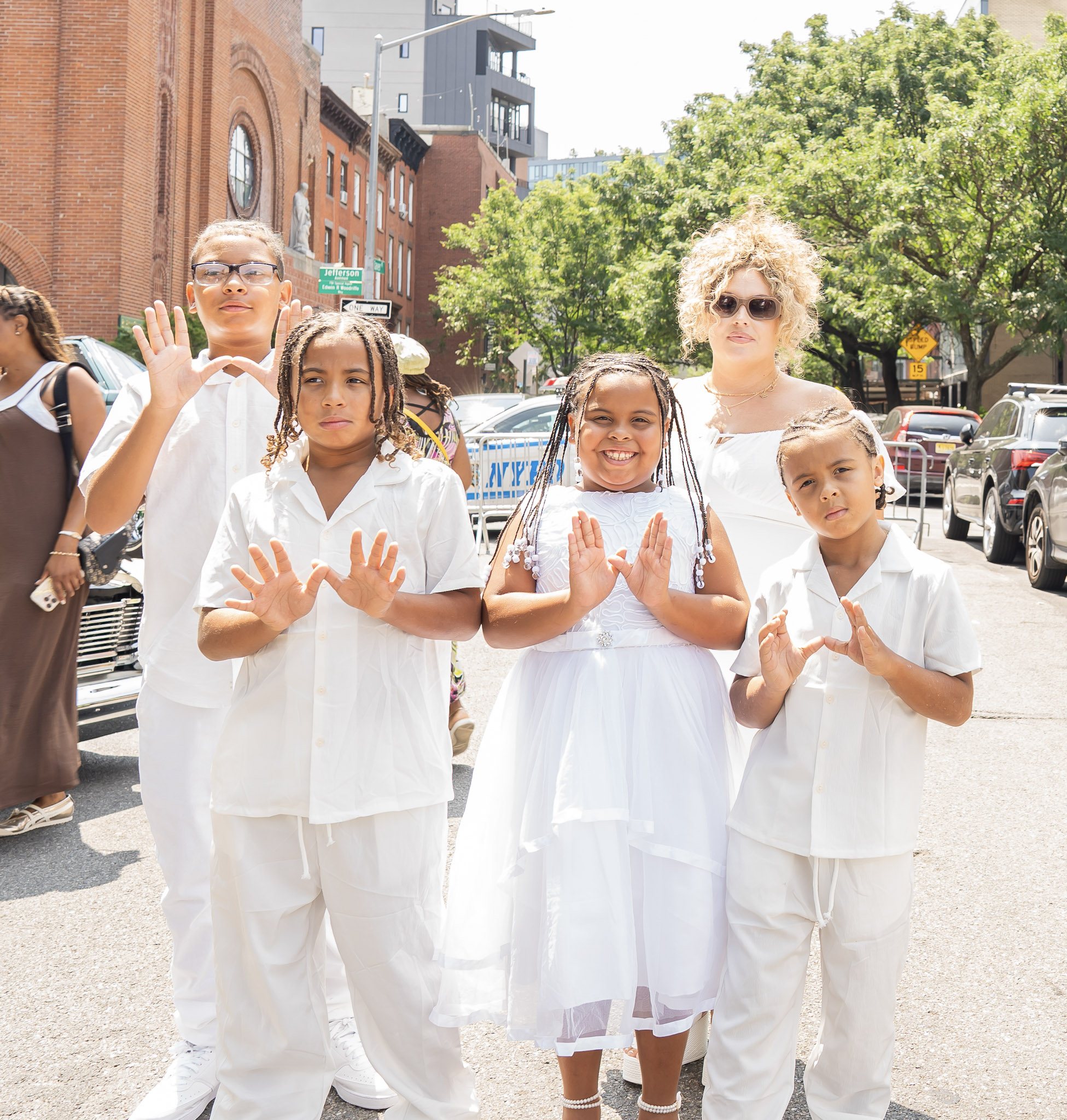 United in white, members of the Jones family celebrate the unveiling of ODB Jones Way,