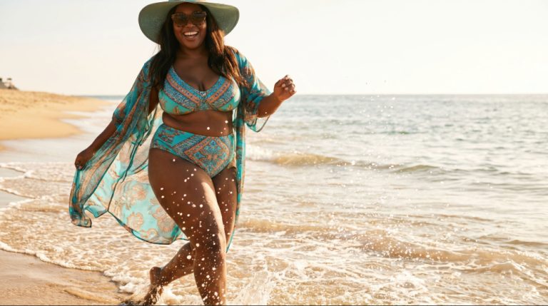 Who Are You Now? When the Woman You Had to Be No Longer Fits - Black woman walking along the beach